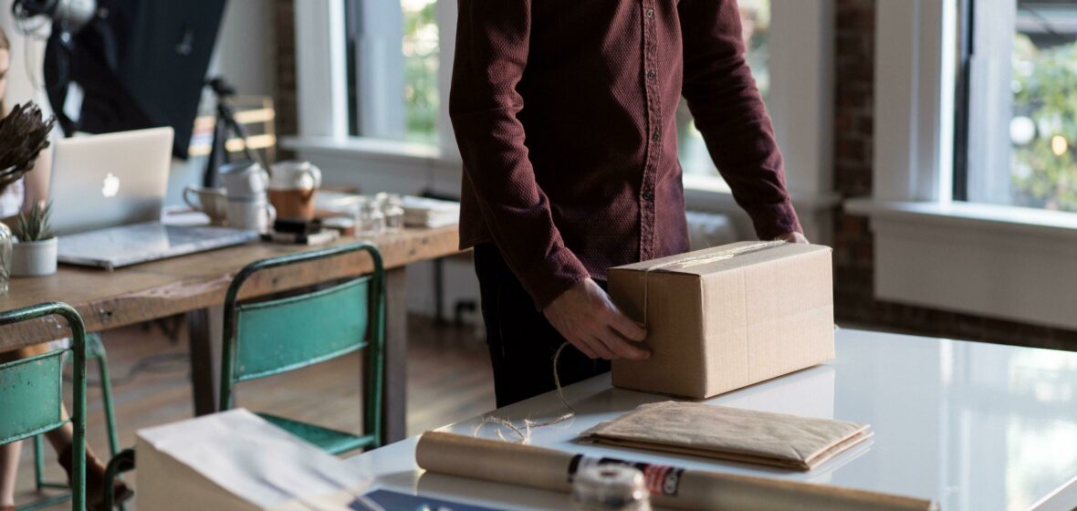Office Setting Send Collect Preparing Parcel for Shipping